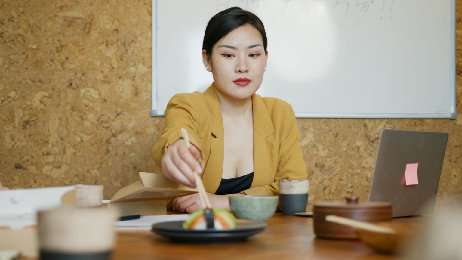 Healthy lunch on desk with vegetables, fruits, and balanced meal for energy and focus
